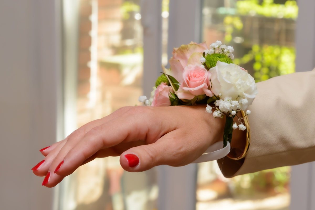 Wrist corsage of pink and white roses